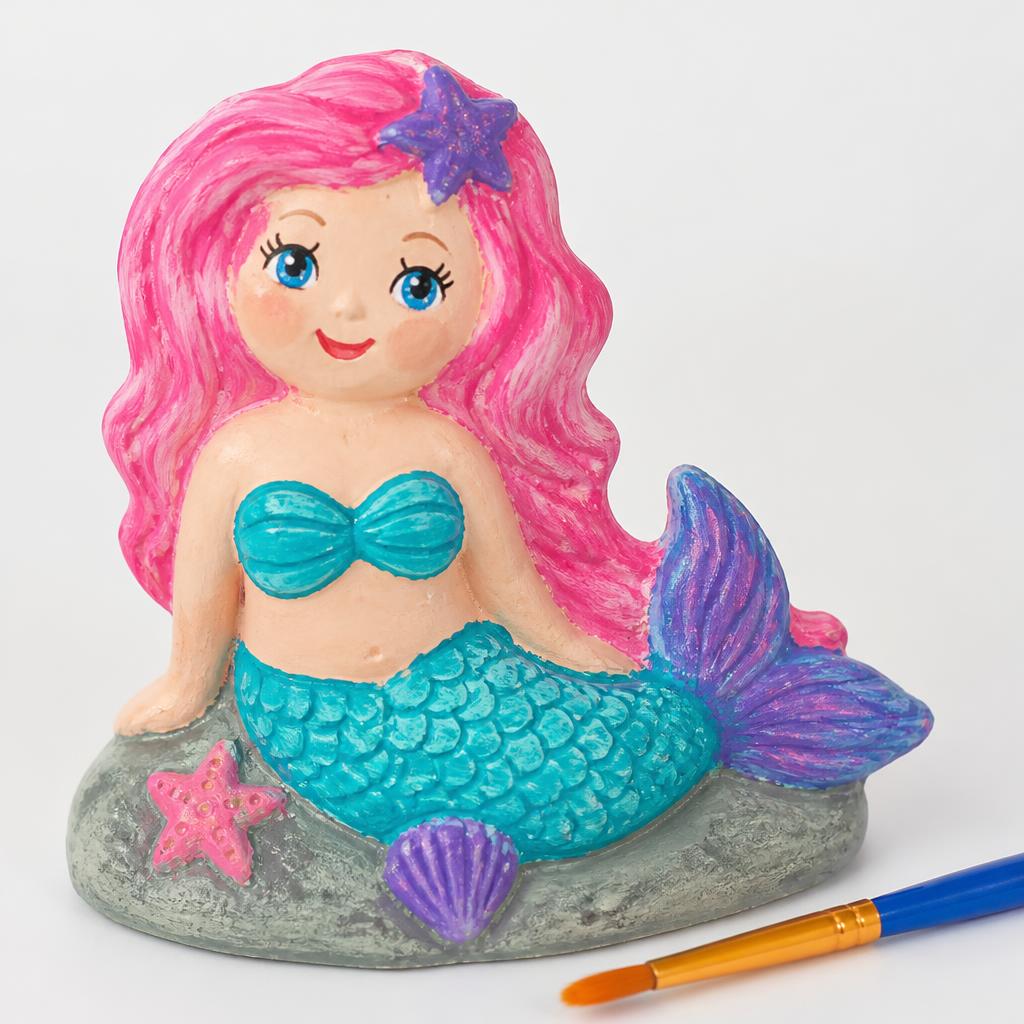 A hand-painted pink-haired mermaid plaster figurine